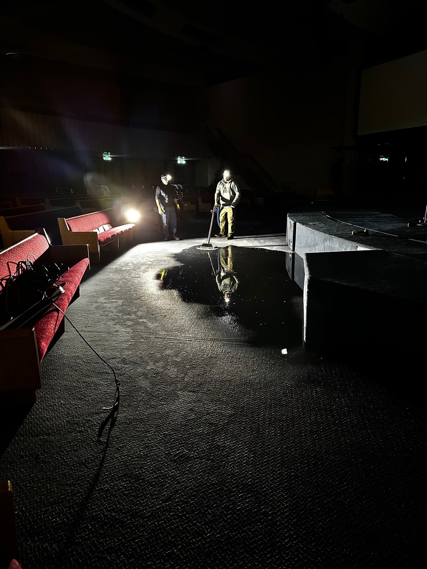 Moisture Pro technicians performing emergency water extraction at night